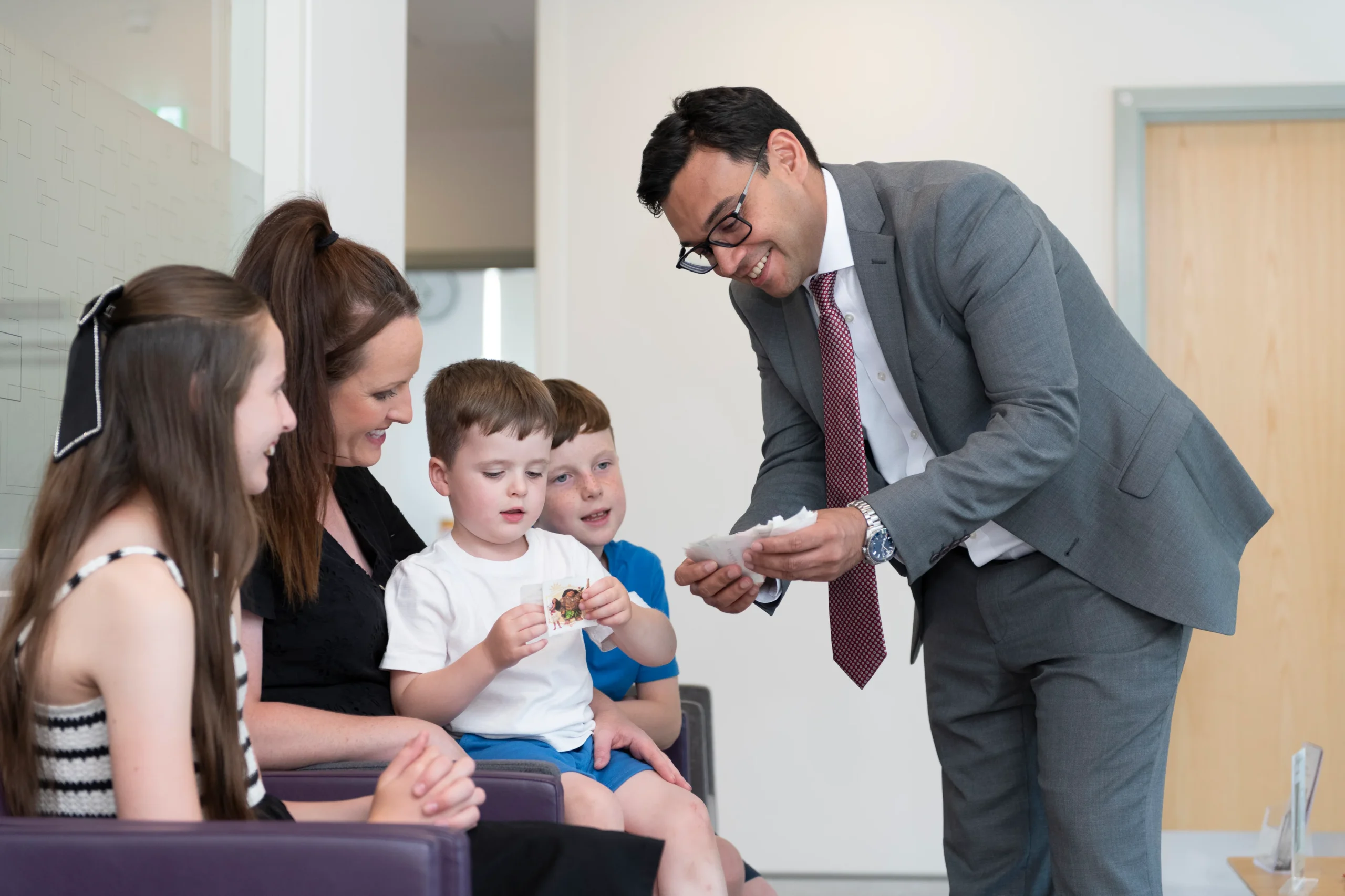 Consultant paediatrician reviewing clinical notes